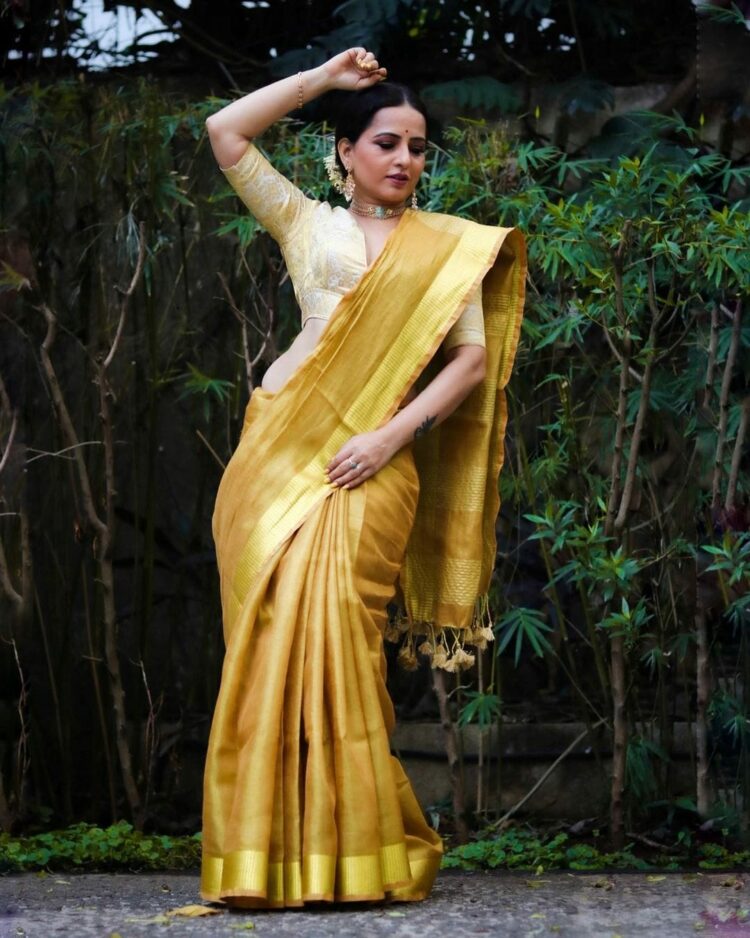 Golden tissue linen saree with matching blouse piece and soft shine