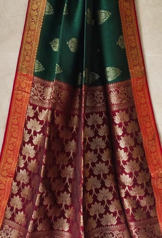 Dazzling Dark Green Banarasi Weave Linen Saree For Happy Occassions