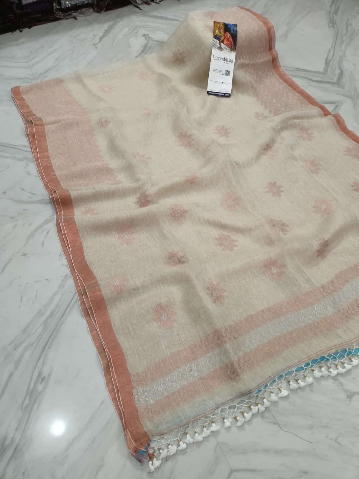 Subtle OffWhite Linen Saree With Thin Copper Border And Lovely Tassels