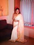 Mesmerizing White Plain Linen Saree with Golden Red Border Onam Special2