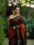 Mesmerizing Rust Black Handwoven Linen Saree With Lotus Design Pallu