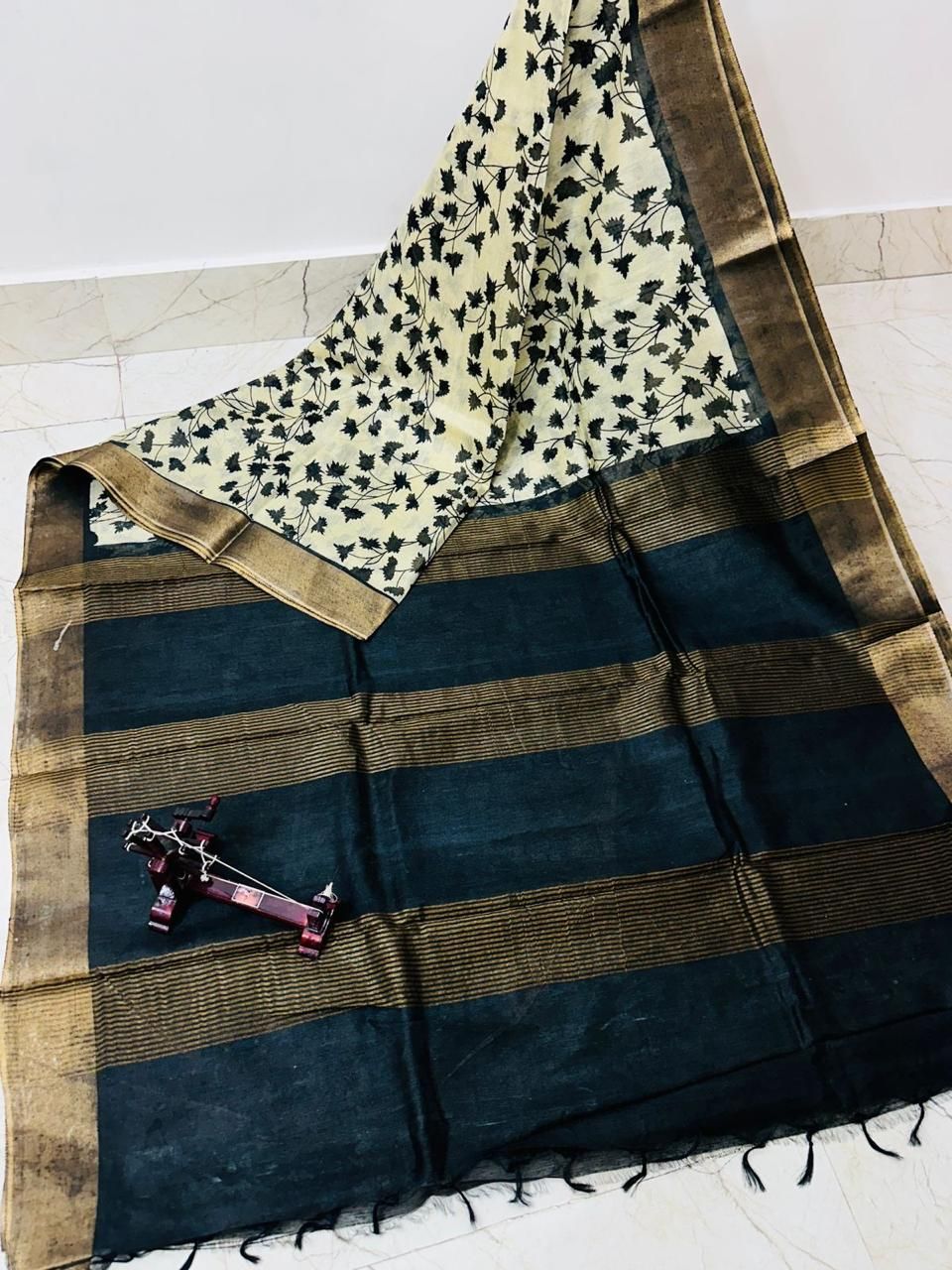 Adorable Black Leafy Printed Katan Cotton Silk Saree with Golden Border