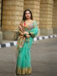 Mesmerizing Turquoise Green Resham Muslin Silk Banarasi Design Saree