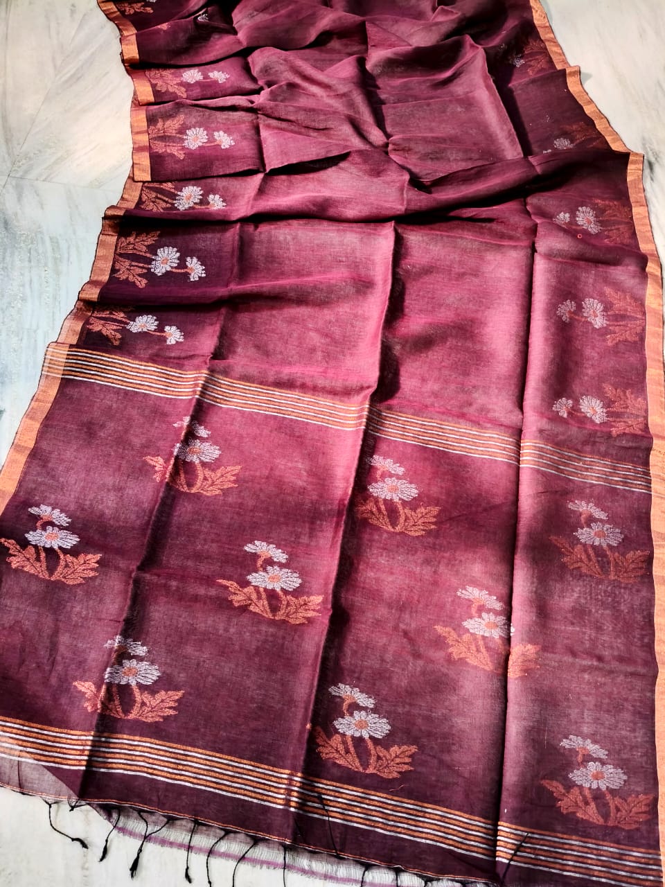 Marvellous Maroon Tissue Linen Saree Handwoven With Floral Design