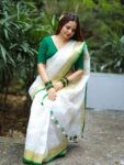 Param Sundari Golden Check Linen Saree With Green Selvedge Border