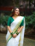 Param Sundari Golden Check Linen Saree With Green Selvedge Border