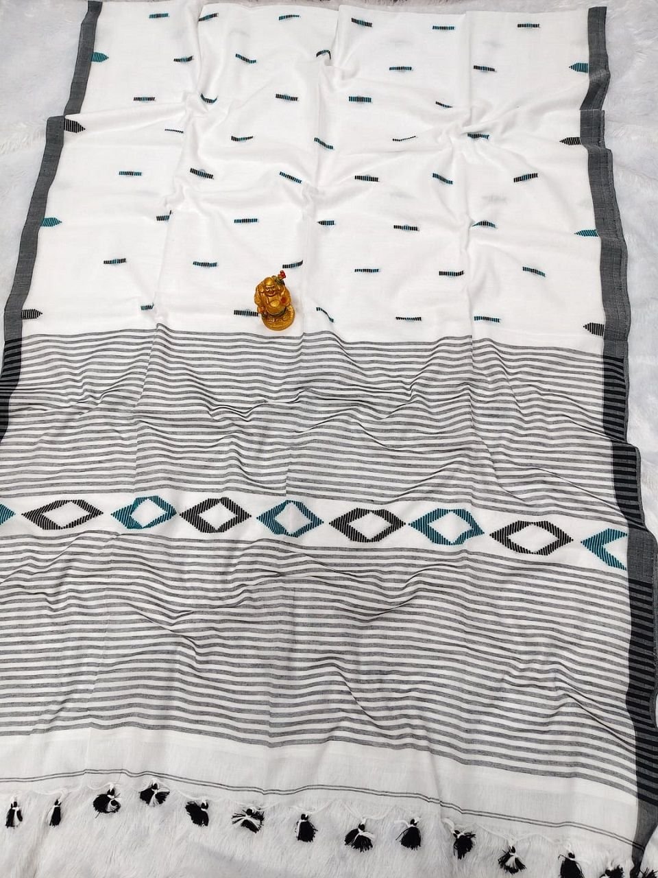 White Teal Pure Cotton Handloom Saree With Allover Woven Ikkat Design Motifs White Teal Pure Cotton Handloom Saree With Allover Woven Ikkat Design Motifs