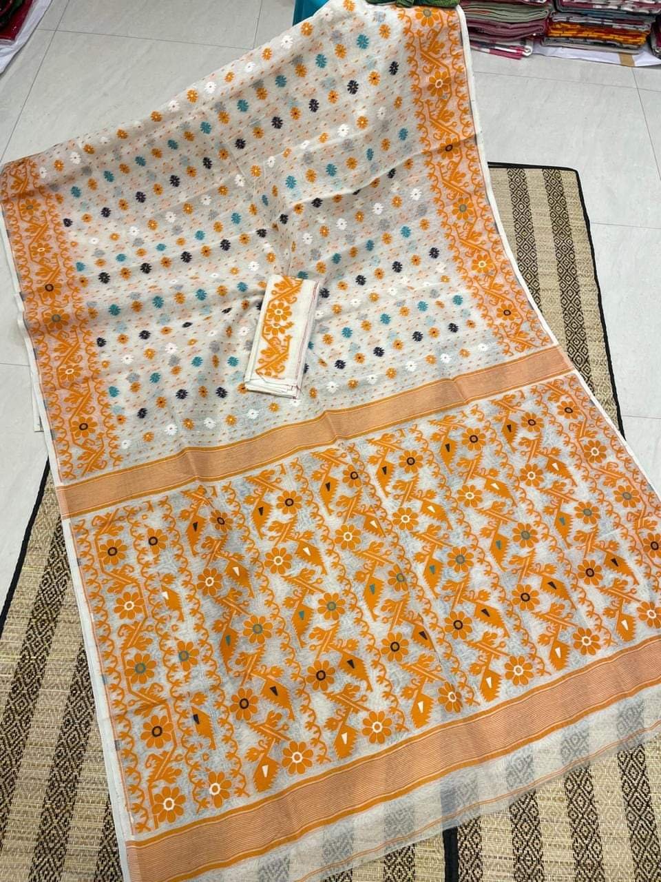 White Orange Floral Dhakai Jamdani Cotton Silk Saree With Blouse White Orange Floral Dhakai Jamdani Cotton Silk Saree With Blouse